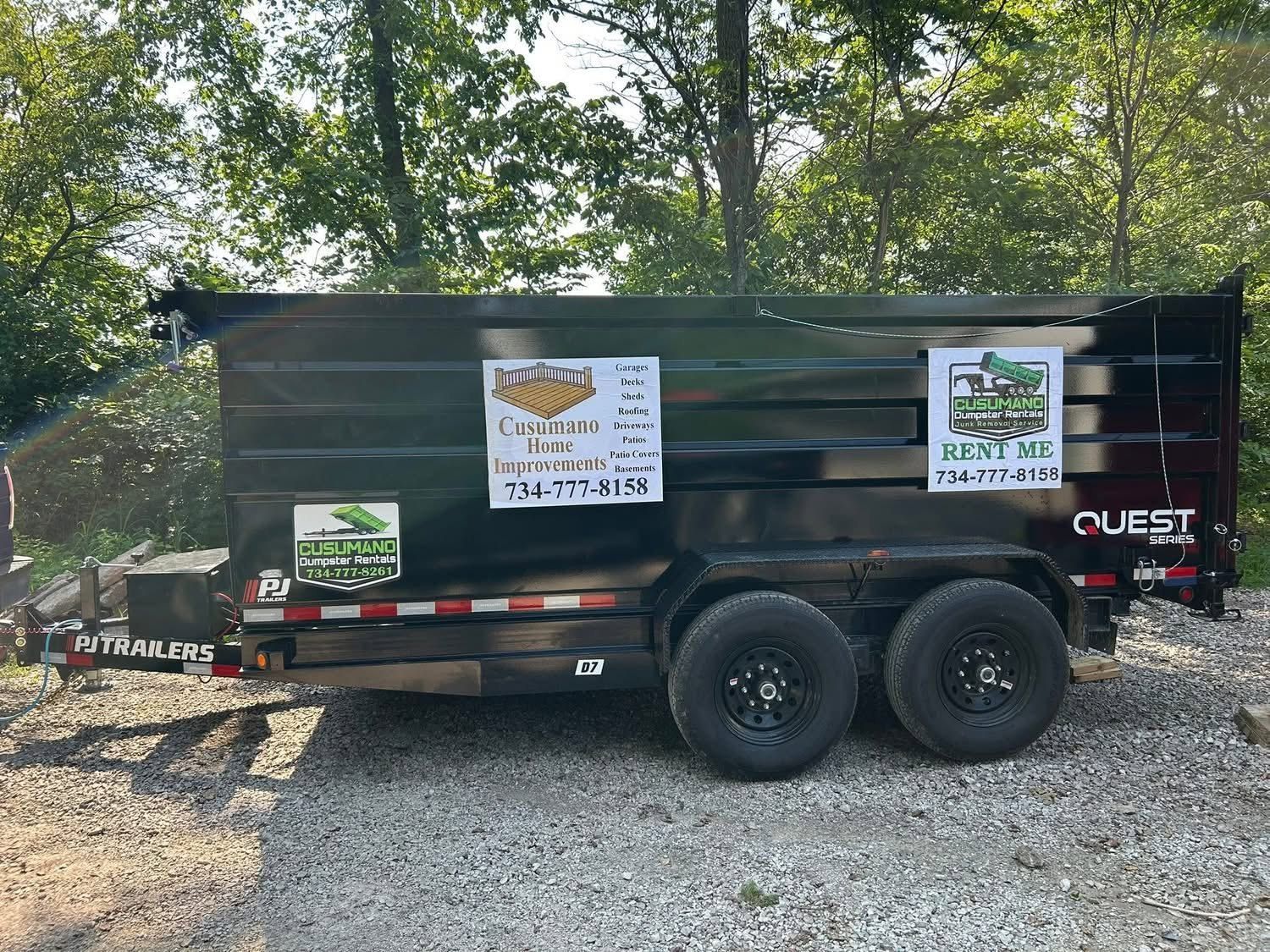 Black Cusumano dump trailer, side view